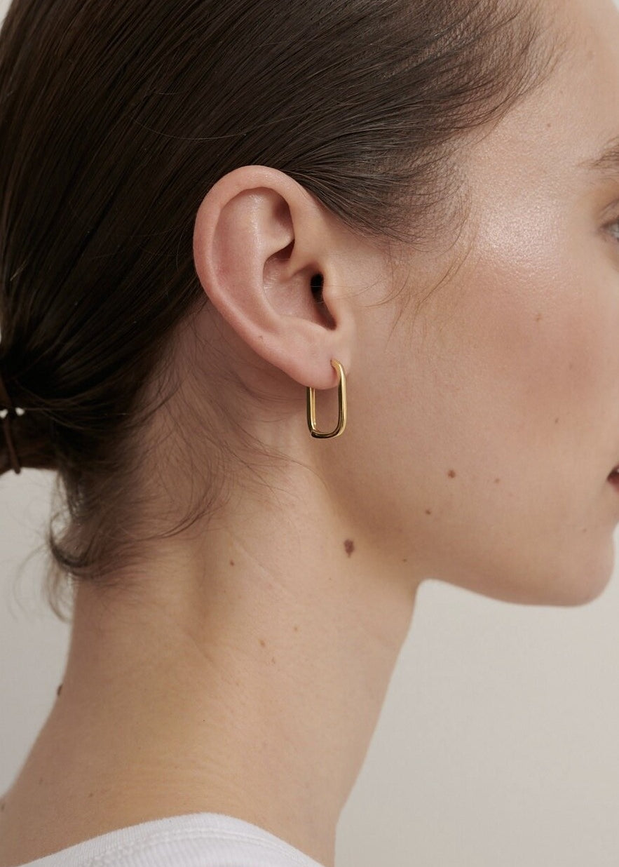 Featured: A Gold Squoval shaped, dainty hoop earring.  (6695455457361)