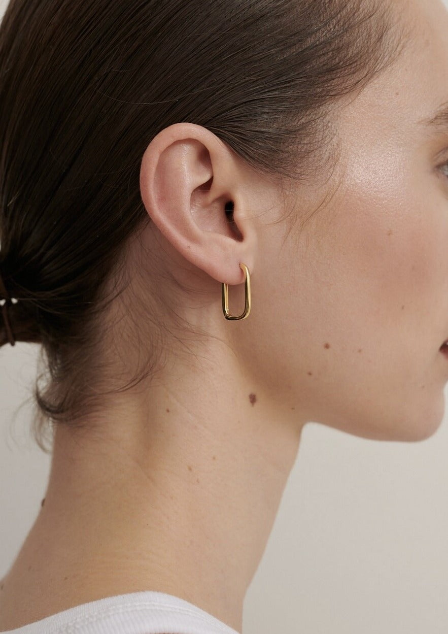 Featured: A Gold Squoval shaped, dainty hoop earring.  (6695455457361)