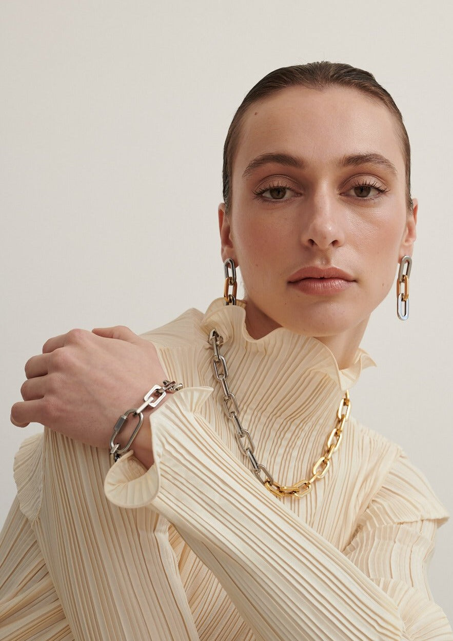 Model Wears Gunmetal Lock It Up Bracelet with Two Tone Chain and Two Tone Chunky Chain Earrings (6695456047185)