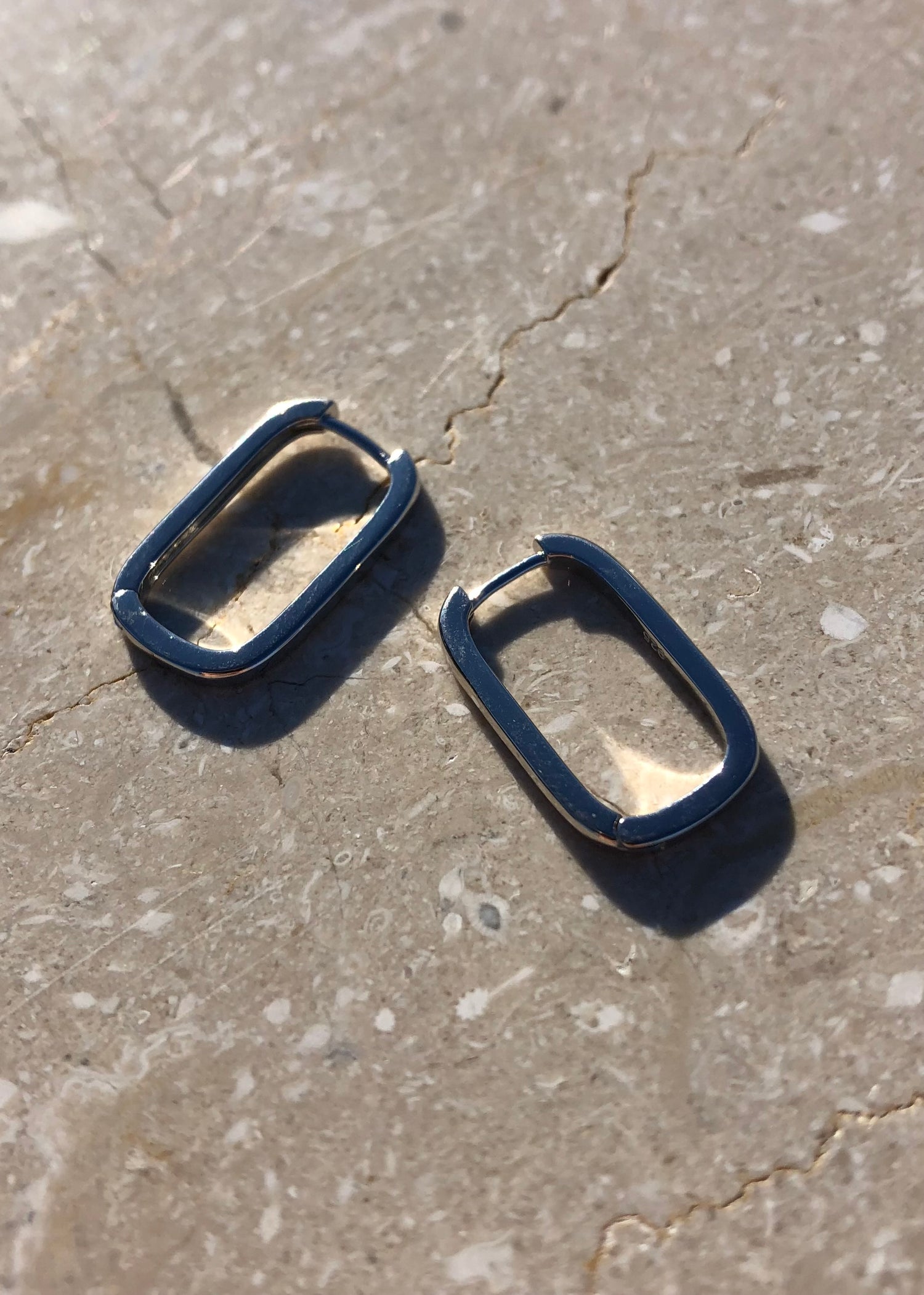 Featured: A Pair of Silver Squoval shaped, dainty hoop earring.  (6695455457361)